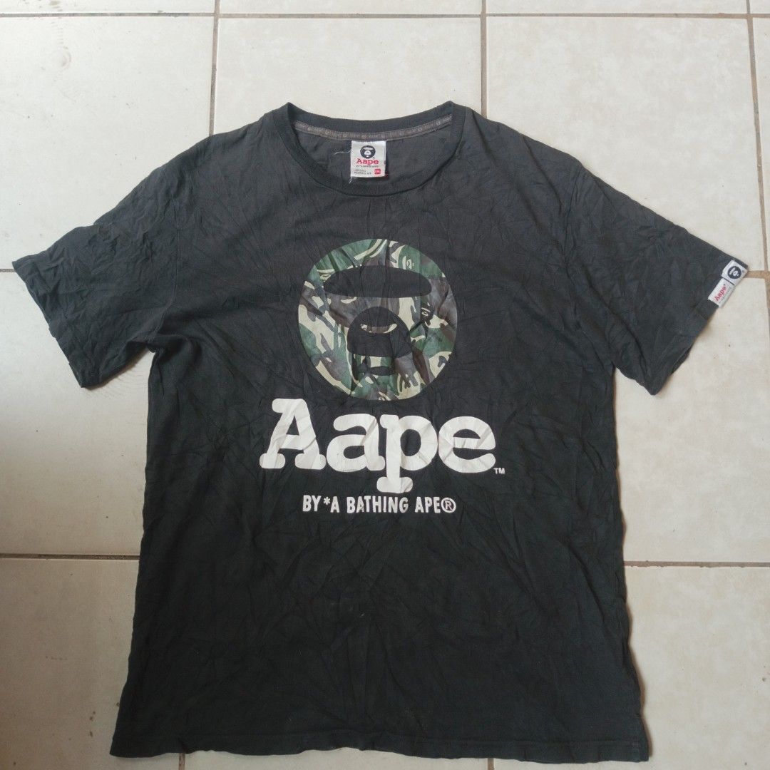 AAPE CAMO BLACK TEE by *A BATHING APE (Category: Tshirts & Polo Shirts ) located in Cagayan de Oro. Submitted by kennthought (Listing ID 1470220970, Image 1). Description: AAPE CAMO BLACK TEE by *A BATHING APE ‎xl on tag ‎length "27 ‎width "20 ‎-color may vary due to bad cam ‎-off/legit ‎-this item is thrifted, pm for more details..