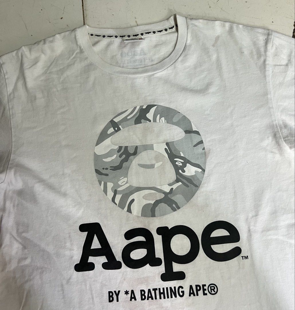 AAPE Camou Tshirt (Category: Tshirts & Polo Shirts ) located in Iloilo. Submitted by deric.john93 (Listing ID 1470224568, Image 2). Description: size large on tag 21 width 28 length no flaws excellent condition 9.8/10 color rate Authentic 1000.