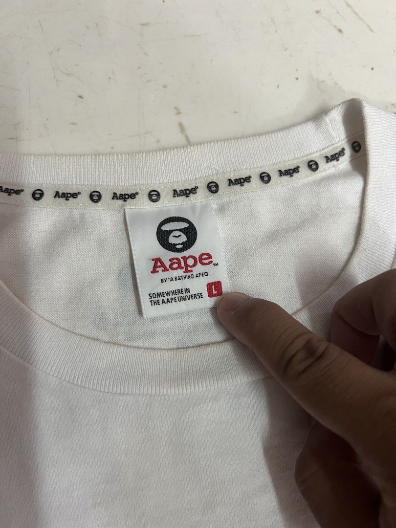 AAPE Camou Tshirt (Category: Tshirts & Polo Shirts ) located in Iloilo. Submitted by deric.john93 (Listing ID 1470224568, Image 3). Description: size large on tag 21 width 28 length no flaws excellent condition 9.8/10 color rate Authentic 1000.