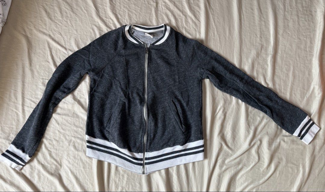 Abercrombie & Fitch Dark Grey Bomber Jacket Size S (Category: Coats, Jackets and Outerwear) located in Pasig City. Submitted by reese2022 (Listing ID 1470252053, Image 1). Description: Abercrombie & Fitch zip-up jacket in dark grey heather. Striped ribbed collar, cuffs, and hem in white and black. Two front welt pockets. Full metal zipper with A&F branding on the pull. .