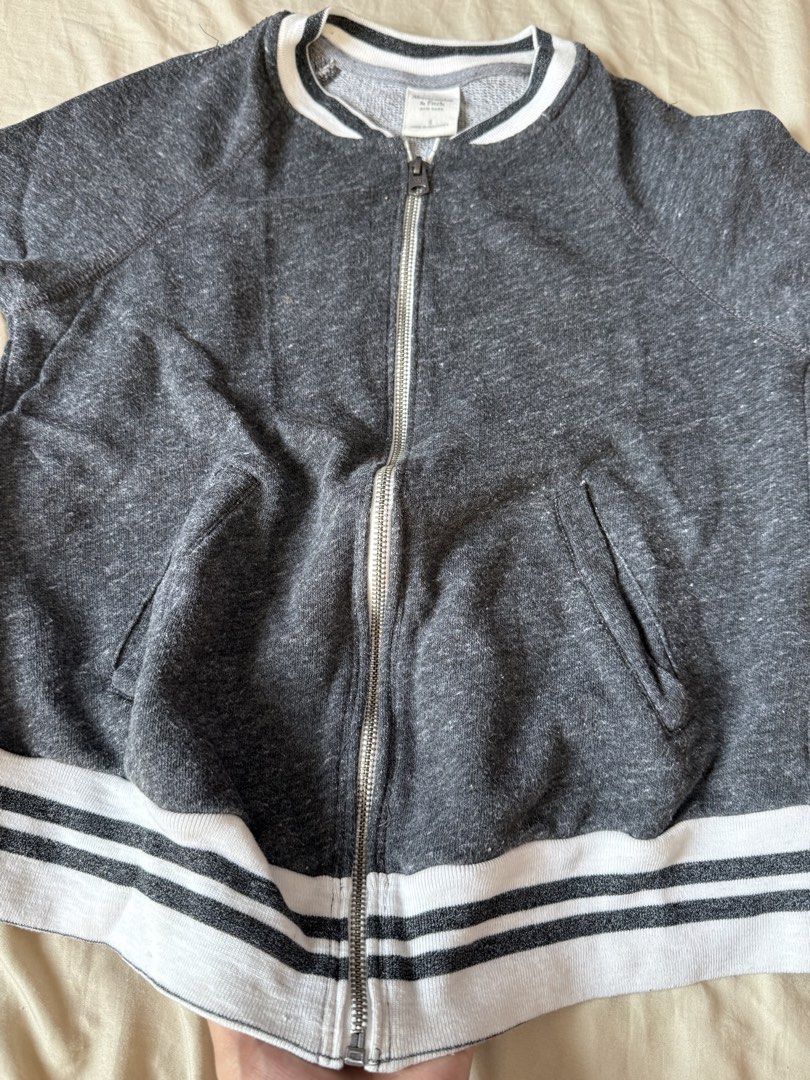 Abercrombie & Fitch Dark Grey Bomber Jacket Size S (Category: Coats, Jackets and Outerwear) located in Pasig City. Submitted by reese2022 (Listing ID 1470252053, Image 2). Description: Abercrombie & Fitch zip-up jacket in dark grey heather. Striped ribbed collar, cuffs, and hem in white and black. Two front welt pockets. Full metal zipper with A&F branding on the pull. .