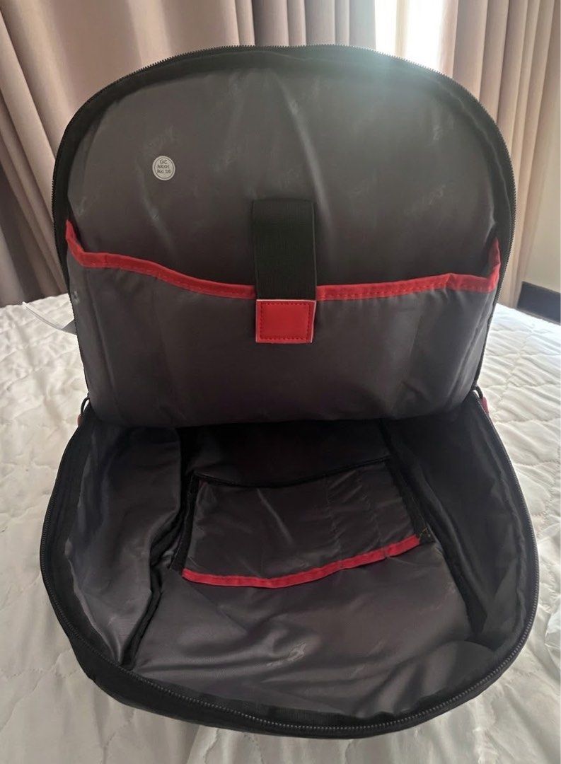 Acer Black Laptop Backpack with Red Accents (Category: Backpacks) located in Taguig. Submitted by tropicana1 (Listing ID 1470307631, Image 3). Description: - Brand: Acer - Color: Black with stylish red zipper pulls and interior trim - Laptop Compartment: Includes a secure strap for safety - Comfort: Padded shoulder straps and breathable mesh back panel - Organization: Multiple smaller interior compartments for easy storage - Durability: Solid bot