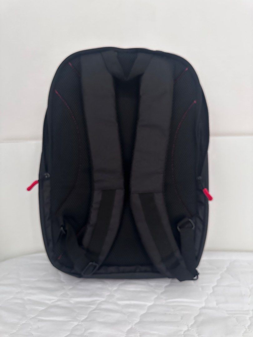 Acer Black Laptop Backpack with Red Accents (Category: Backpacks) located in Taguig. Submitted by tropicana1 (Listing ID 1470307631, Image 2). Description: - Brand: Acer - Color: Black with stylish red zipper pulls and interior trim - Laptop Compartment: Includes a secure strap for safety - Comfort: Padded shoulder straps and breathable mesh back panel - Organization: Multiple smaller interior compartments for easy storage - Durability: Solid bot