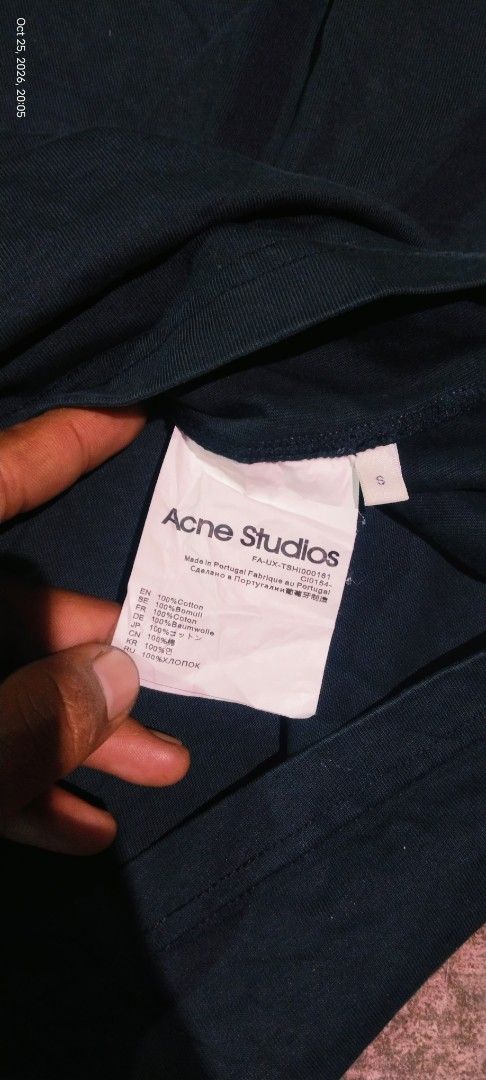 Acne Studios Pink Black Tie Dye Tee Size S (Category: Shirts) located in Caloocan City. Submitted by alihpena1906427 (Listing ID 1470302312, Image 2). Description: - Brand: Acne Studios - Color: Black with bright pink tie-dye chest stripe - Details: Iconic embroidered face logo patch on front - Size: Small (white care tag) - Material: 100% cotton, Made in Portugal - Fit: Relaxed fit, short sleeves - Styling: Easy to style with denim or black trou