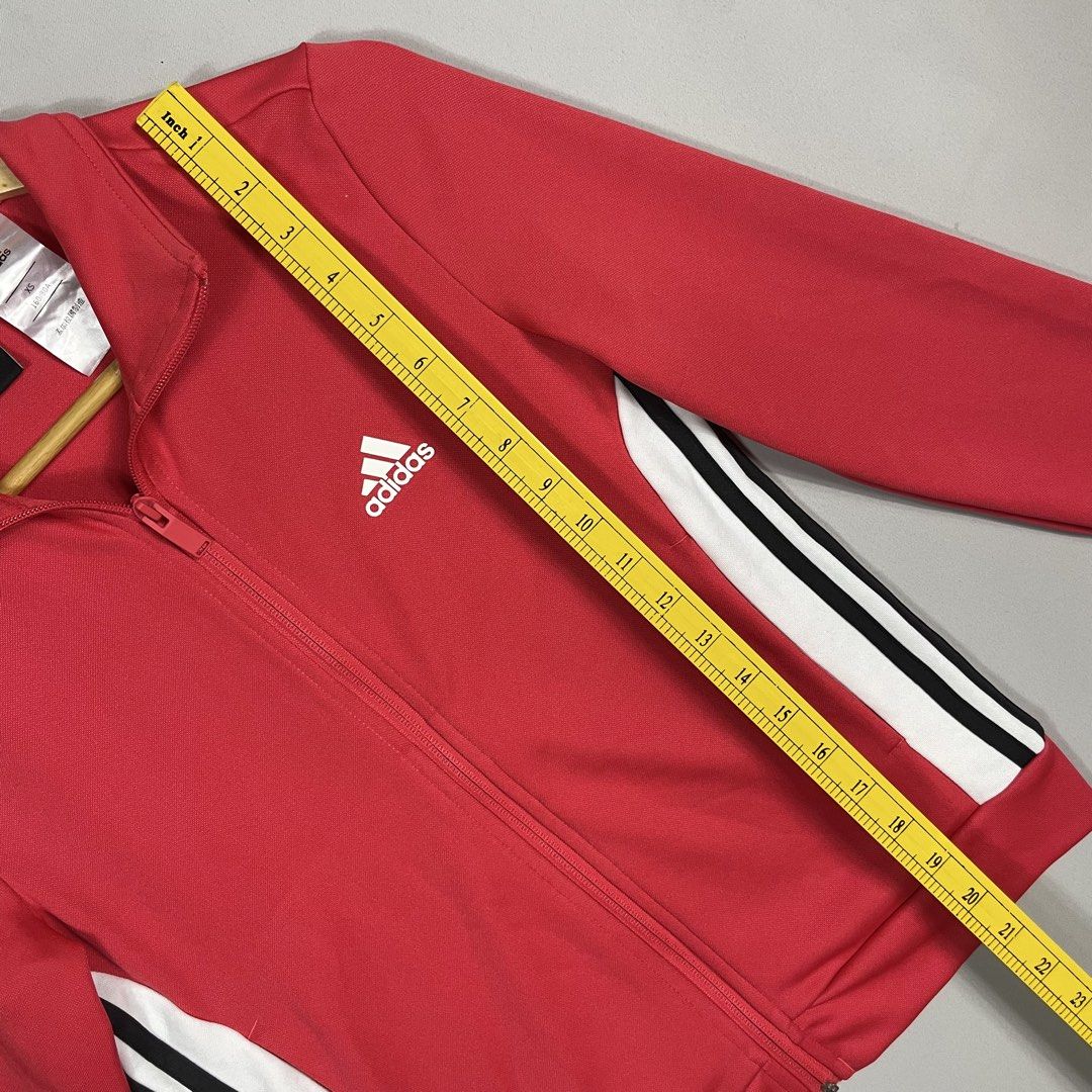 ADIDAS | Bright Pink Red Full-Zip Track Jacket (Category: Coats, Jackets and Outerwear) located in Norzagaray. Submitted by sevenjscloset (Listing ID 1470259247, Image 3). Description: - Brand: Adidas - Color: Bright pink and red with white and black side stripes - Size: XS (Length: 20.5", Width: 16" - modeled by 5'2" / 50kg) - Condition: Clean, excellent, no issues found - Features: Full-zip closure and ribbed cuffs - Style: Great everyday sport
