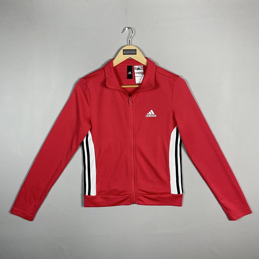 ADIDAS | Bright Pink Red Full-Zip Track Jacket (Category: Coats, Jackets and Outerwear) located in Norzagaray. Submitted by sevenjscloset (Listing ID 1470259247, Image 1). Description: - Brand: Adidas - Color: Bright pink and red with white and black side stripes - Size: XS (Length: 20.5", Width: 16" - modeled by 5'2" / 50kg) - Condition: Clean, excellent, no issues found - Features: Full-zip closure and ribbed cuffs - Style: Great everyday sport