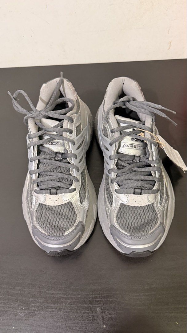 Adidas Adistar Cushion Silver Grey Sneakers US 7 (Category: Sneakers) located in Makati City. Submitted by t3rdiii (Listing ID 1470198649, Image 1). Description: Adidas Adistar – Brand New 👟 • Size: US 7 (can fit up to US 7.5) • Brand new, never worn • No box • Authentic adidas • RFS: Too chunky for me 💰 ₱3,500 – negotiable 🔄 Open to barter — just offer! PM if interested. 😊 - Brand: Adidas Adistar Cushion - Color: Metallic Silver and Grey - S