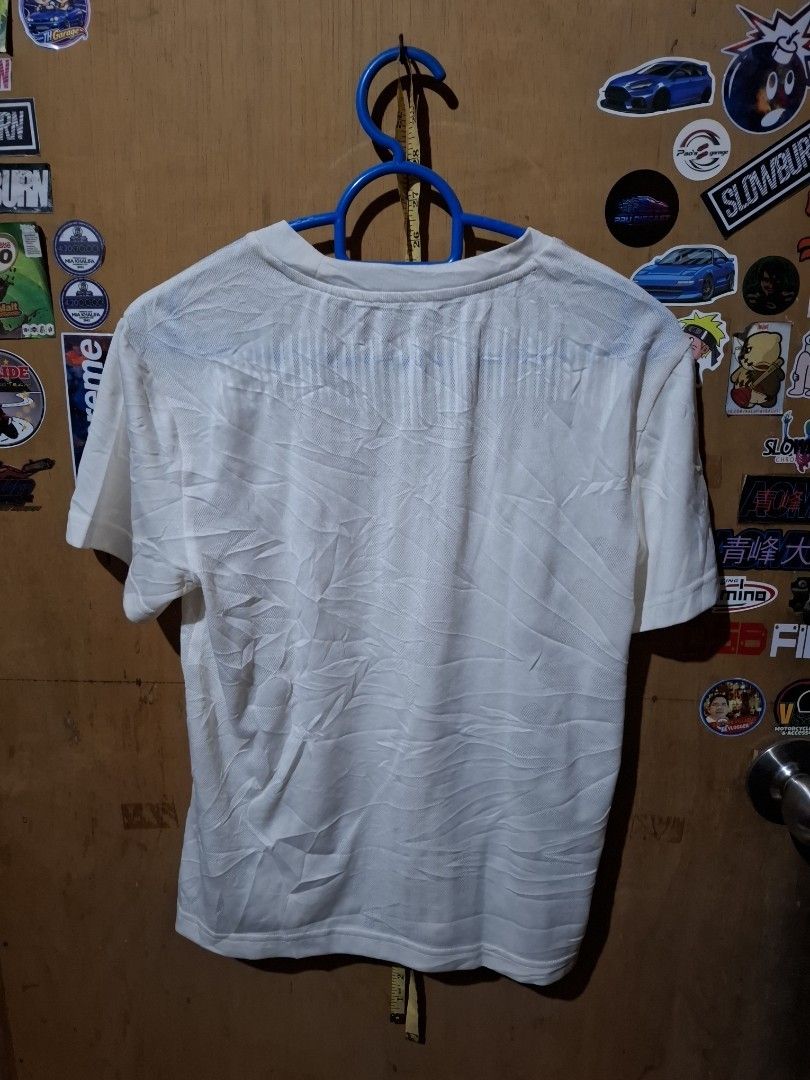 Adidas Aichill White T-shirt (Category: Shirts) located in Victorias. Submitted by doc_keith (Listing ID 1470297940, Image 3). Description: Brand: Adidas Aichill -size:small (17x21.5) Color: White - Style: Short sleeve top, standard fit Fabric: Breathable, lightweight textured material with a subtle wavy pattern Details: Center chest logo and signature Aichill collar tape Condition: Clean and well-maintained - Versatility: Ideal for training or c