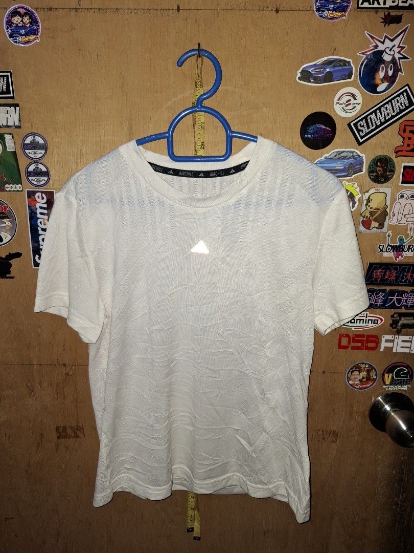 Adidas Aichill White T-shirt (Category: Shirts) located in Victorias. Submitted by doc_keith (Listing ID 1470297940, Image 2). Description: Brand: Adidas Aichill -size:small (17x21.5) Color: White - Style: Short sleeve top, standard fit Fabric: Breathable, lightweight textured material with a subtle wavy pattern Details: Center chest logo and signature Aichill collar tape Condition: Clean and well-maintained - Versatility: Ideal for training or c
