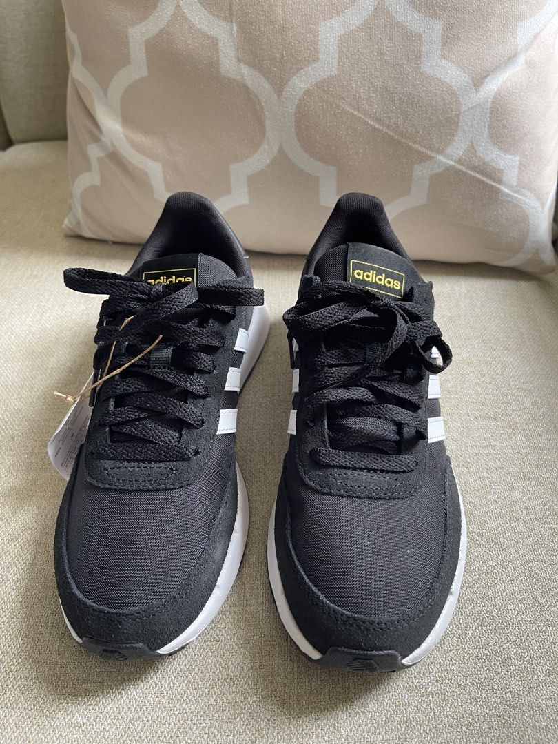 Adidas Black and White Sneakers (Category: Sneakers) located in Butuan. Submitted by anneven14 (Listing ID 1470292239, Image 3). Description: last price: 1,400- Brand: Adidas - Color: Black with white stripes and gold branding - Condition: Brand new with original tags attached - Features: Traditional lace-up closure, thick white midsole, and textured black rubber outsole - Extras: Original packing paper still stuffed inside to maintain shape.