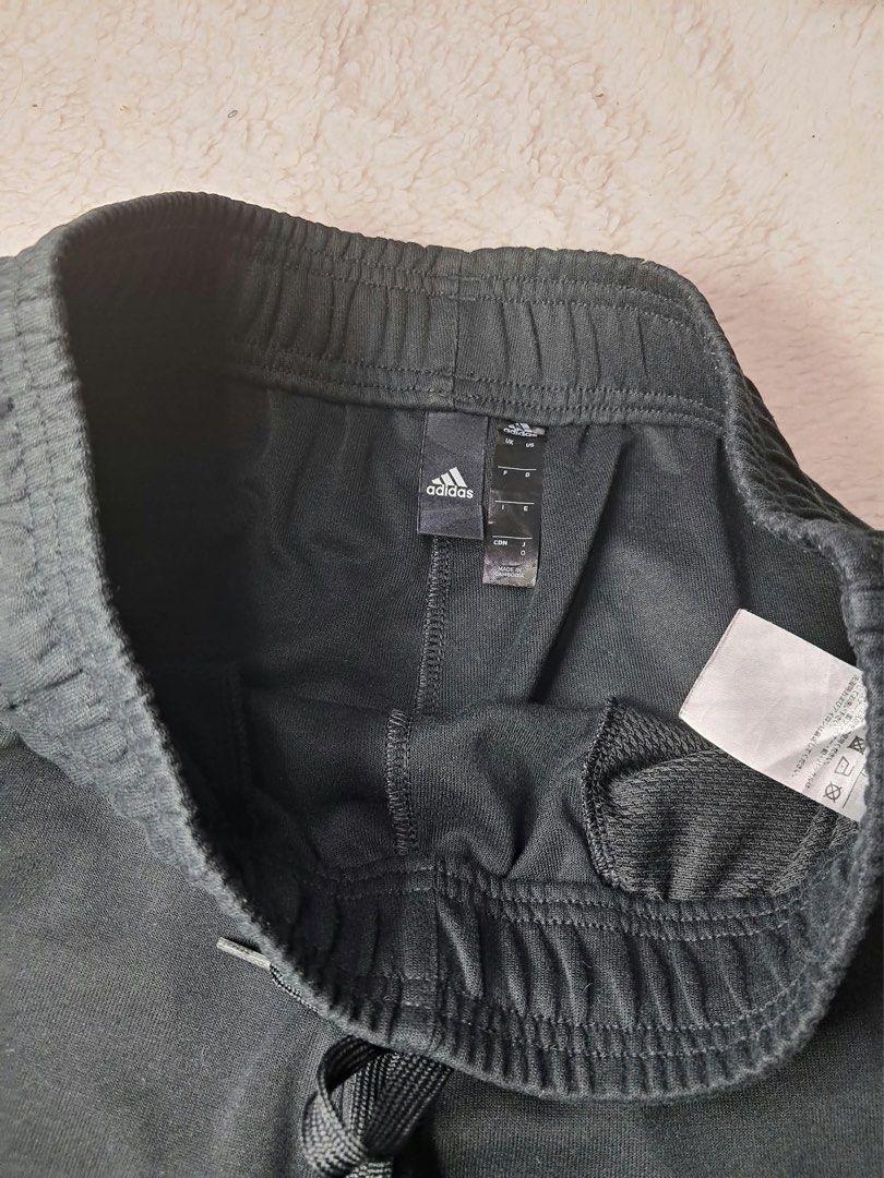 Adidas Black Joggers Sweatpants (Category: Joggers) located in Baguio. Submitted by padisellsz (Listing ID 1470254032, Image 3). Description: - 100% Authentic Adidas black joggers - Very good condition - Eco-friendly: Made from 100% recycled polyester - Design: Iconic round Adidas logo near left knee & 3 white stripes on back right hip - Fit & Comfort: Elastic waistband with adjustable drawstrings & cuffed ankles - Practicality: Equipped with con