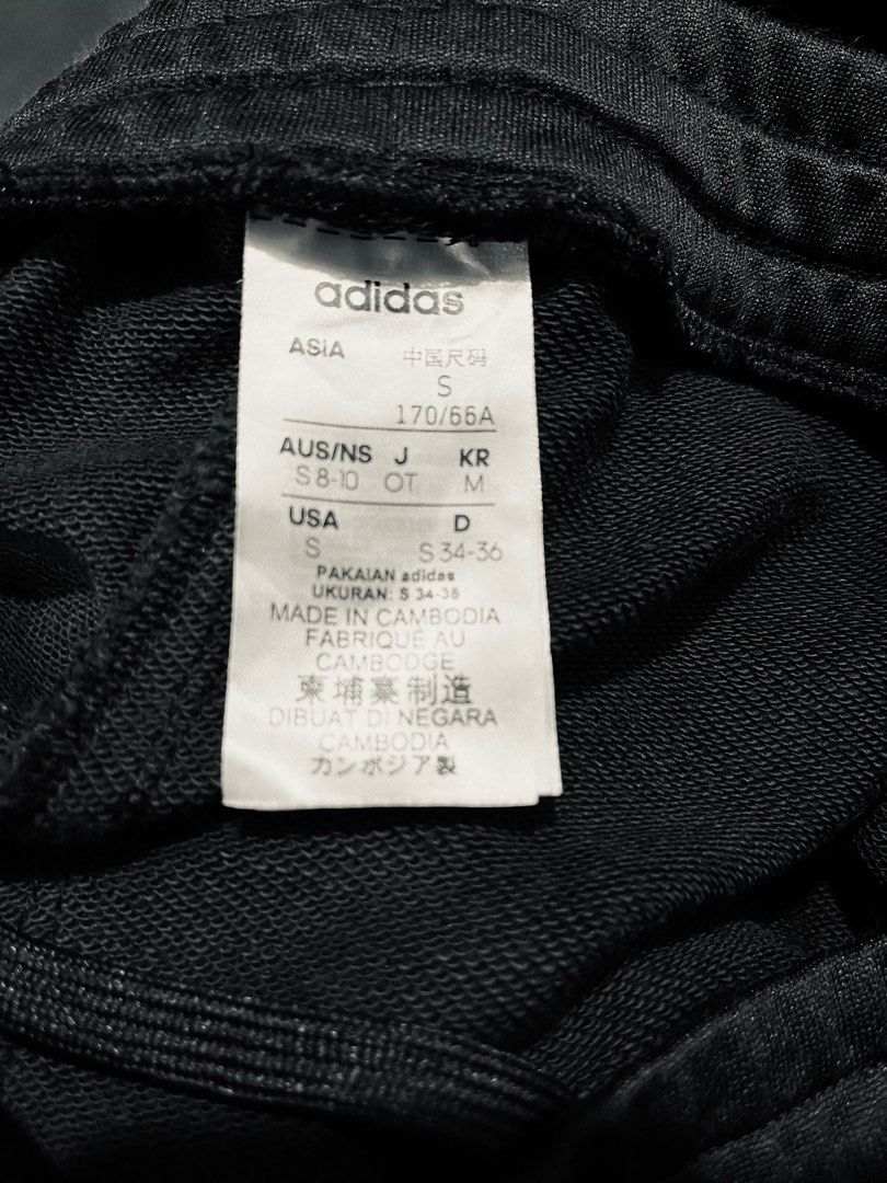 Adidas Black Track Pants with White Stripes Size S (Category: Joggers) located in Marikina City. Submitted by sakura_07 (Listing ID 1470146533, Image 2). Description: - Brand: Adidas - Color: Classic black with white stripes - Size: Small (S) based on tag - Material: Comfortable and breathable cotton-blend fabric - Features: Elastic waistband with adjustable drawstring - Details: White Adidas logo near the pocket and functional zippers at the cuf