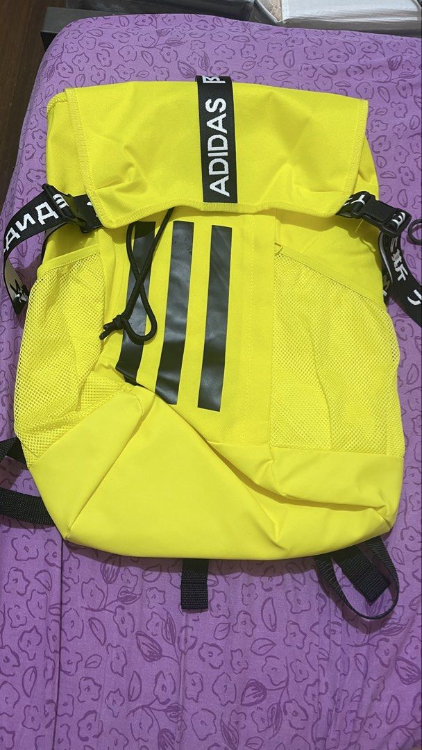 Adidas Bright Yellow Backpack with Black Straps (Category: Backpacks) located in Quezon City. Submitted by timmytheninja (Listing ID 1470161011, Image 1). Description: - Vibrant yellow Adidas backpack with striking black straps and bold branding - Durable fabric material with secure zipper closure and clean yellow zipper pull - Convenient mesh side pockets on both sides for water bottles or essentials - Adjustable shoulder straps featuring the ic