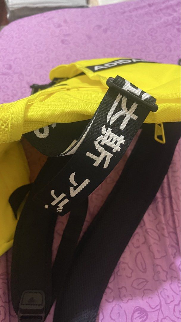 Adidas Bright Yellow Backpack with Black Straps (Category: Backpacks) located in Quezon City. Submitted by timmytheninja (Listing ID 1470161011, Image 3). Description: - Vibrant yellow Adidas backpack with striking black straps and bold branding - Durable fabric material with secure zipper closure and clean yellow zipper pull - Convenient mesh side pockets on both sides for water bottles or essentials - Adjustable shoulder straps featuring the ic