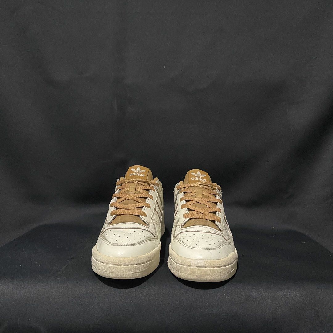 Adidas Forum Low White Tan US 7.5 (Category: Sneakers) located in Bulacan. Submitted by ogieeee (Listing ID 1470236459, Image 3). Description: - Brand: Adidas Forum Low - Colorway: White and Tan - Size: US 7.5 / EUR 40.5 / CM 25.5 - Design: Classic basketball-inspired low top with perforated toe box and ankle strap - Style: Versatile neutral tones, perfect for any casual outfit - Condition: Closet clean-out find, priced to move quickly.