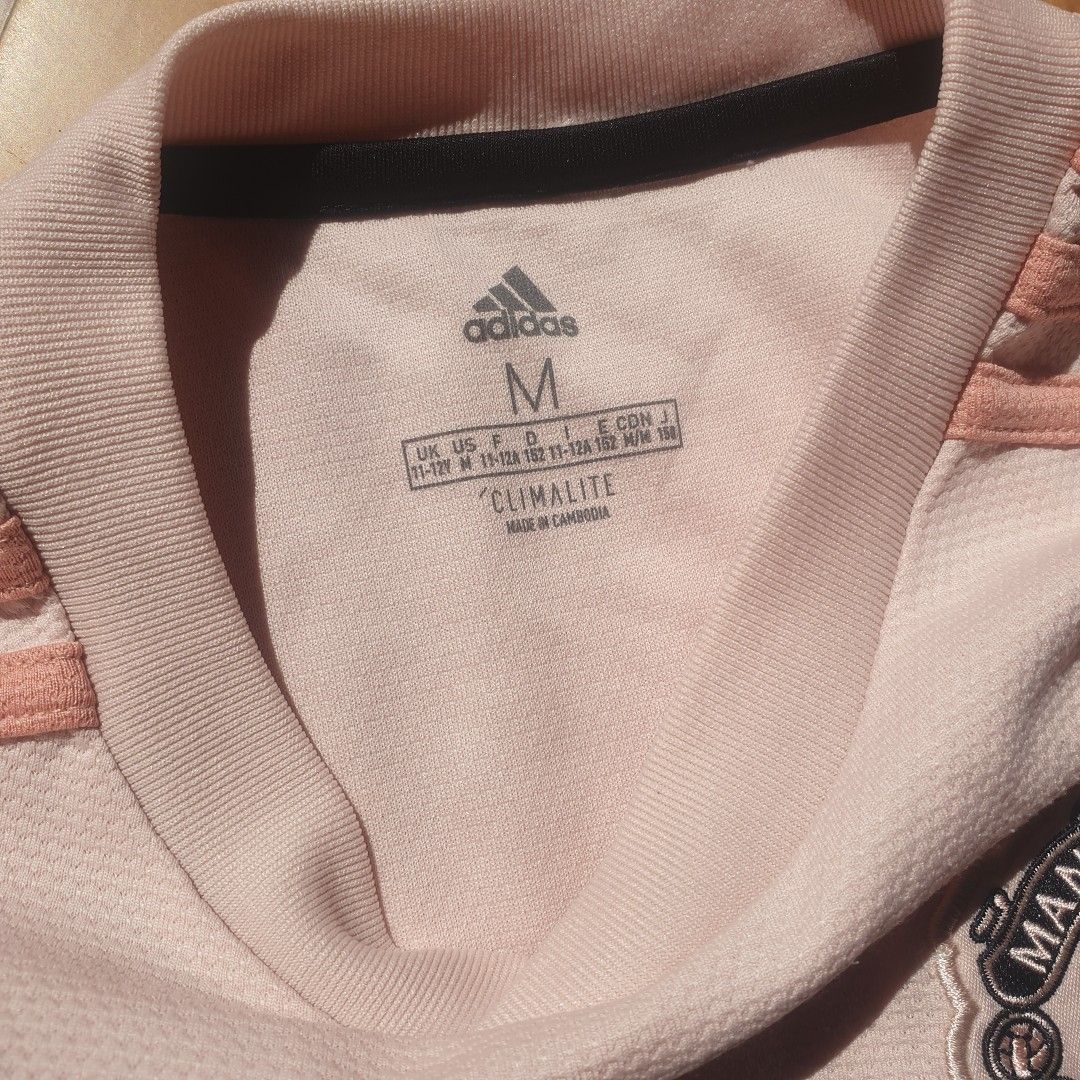 Classic retro Adidas manchester athlete (Category: Activewear) located in Paranaque City. Submitted by nvdluxurygoods (Listing ID 1470161736, Image 3). Description: Size m on tag for women For sale: Adidas Manchester United Shirt in pink (original) 🏷800 only No flaws no issue 10/10 Ready to ship.