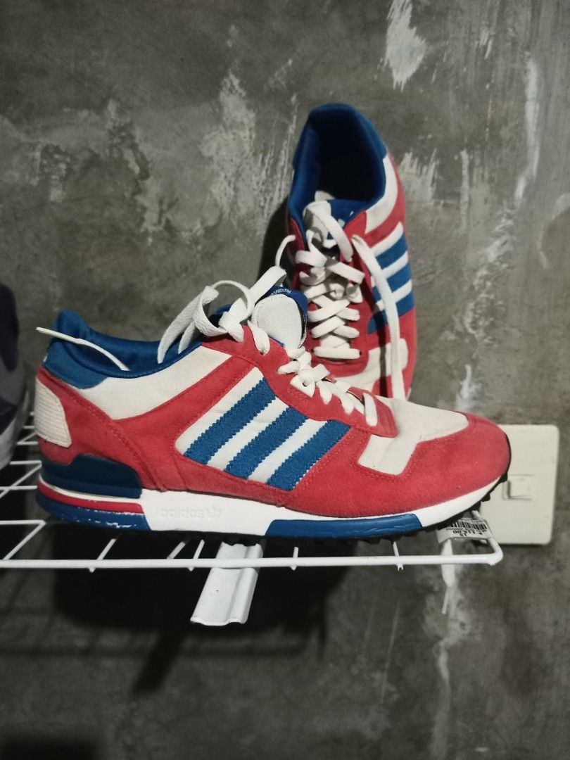 Adidas Retro Red Blue Sneakers Size US 7 (Category: Sneakers) located in Mabalacat. Submitted by hasashoe (Listing ID 1470282485, Image 1). Description: - Brand: Adidas - Style: Retro low-top runner sneakers - Color: Red, white, and blue - Size: US 7 / UK 6.5 / EU 40 - Materials: Suede and fabric upper with black rubber ripple soles for solid grip - Inclusions: Comes with white laces - Condition/Use: Comfortable style, perfect for everyday wear.