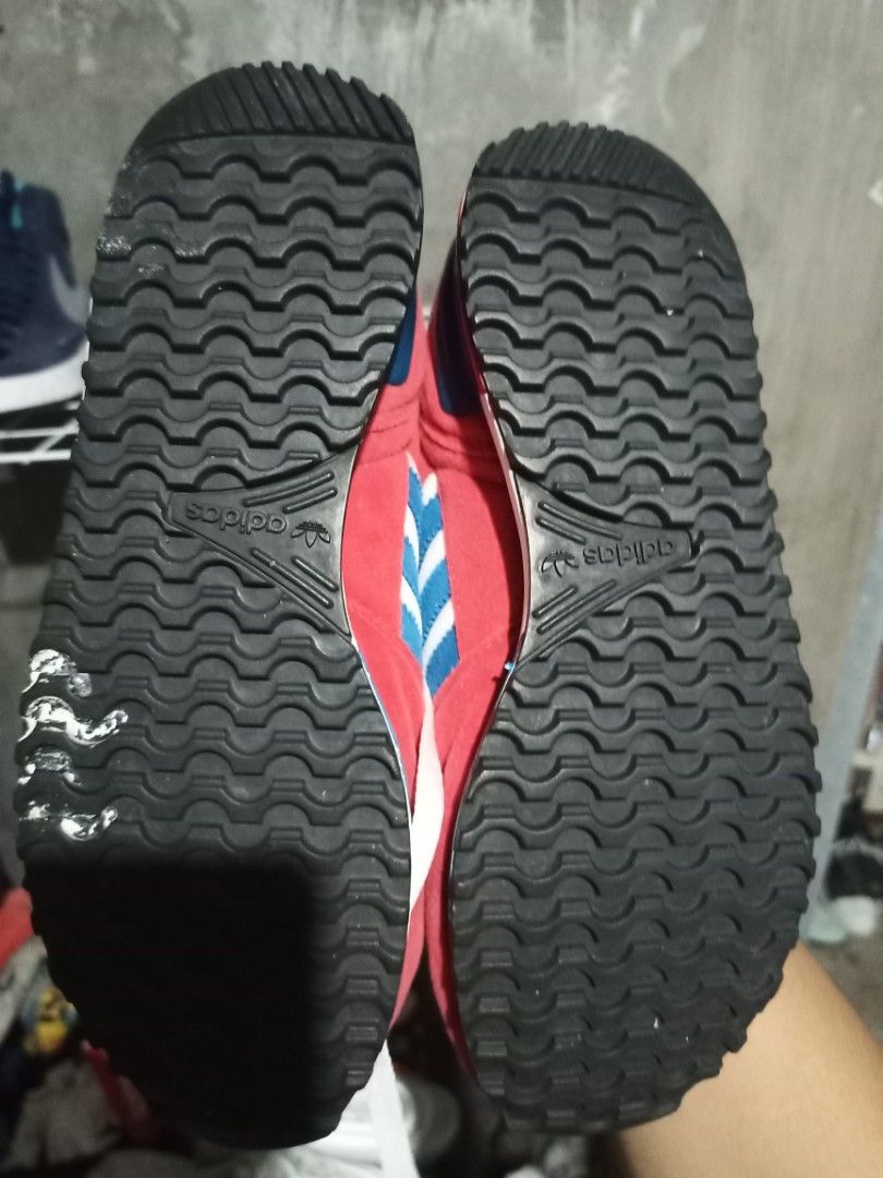 Adidas Retro Red Blue Sneakers Size US 7 (Category: Sneakers) located in Mabalacat. Submitted by hasashoe (Listing ID 1470282485, Image 2). Description: - Brand: Adidas - Style: Retro low-top runner sneakers - Color: Red, white, and blue - Size: US 7 / UK 6.5 / EU 40 - Materials: Suede and fabric upper with black rubber ripple soles for solid grip - Inclusions: Comes with white laces - Condition/Use: Comfortable style, perfect for everyday wear.