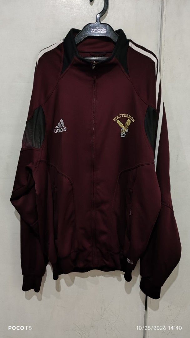Adidas Watterson Maroon Track Jacket (Category: Coats, Jackets and Outerwear) located in Quezon City. Submitted by ralphralph (Listing ID 1470247153, Image 2). Description: - Color: Maroon with black panels and white piping - Brand: Authentic Adidas track jacket with full zip - Details: Embroidered Adidas logo and Watterson eagle team crest - Comfort: Mesh ventilation inserts on upper sleeves, ribbed cuffs and hem - Storage: Convenient side pocke