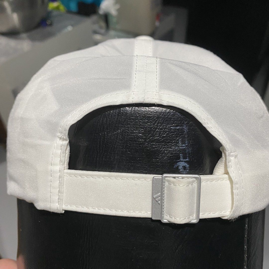Adidas White Aeroready Baseball Cap (Category: Caps & Hats) located in Villasis. Submitted by thriftngrind (Listing ID 1470286816, Image 3). Description: - Authentic white Adidas cap - AEROREADY technology inside keeps sweat away - Classic black logo on the front - Clean white panels with eyelets for breathability - Standard six-panel construction - Adjustable metal strap closure with embossed logo hardware - Great everyday accessory for workouts