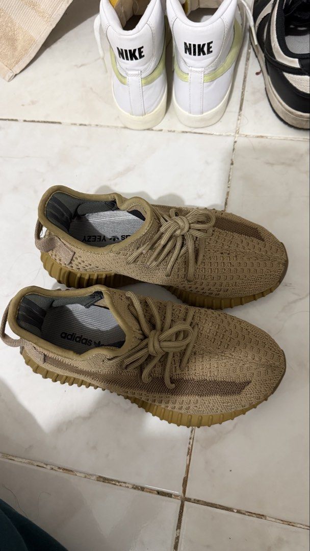 Adidas Yeezy Boost 350 V2 Earth (Category: Sneakers) located in Bacoor. Submitted by kndllklnx (Listing ID 1470250698, Image 3). Description: Adidas Yeezy Boost 350 V2 Earth US 5.5 - Colorway: Earth Brown - Upper: Breathable Prime-knit with translucent side stripe and rope laces - Sole: Ribbed gum rubber with full-length Boost cushioning - Condition: Uppers are clean; minor dirt and heel pad discoloration from previous wear - Perfect for daily we