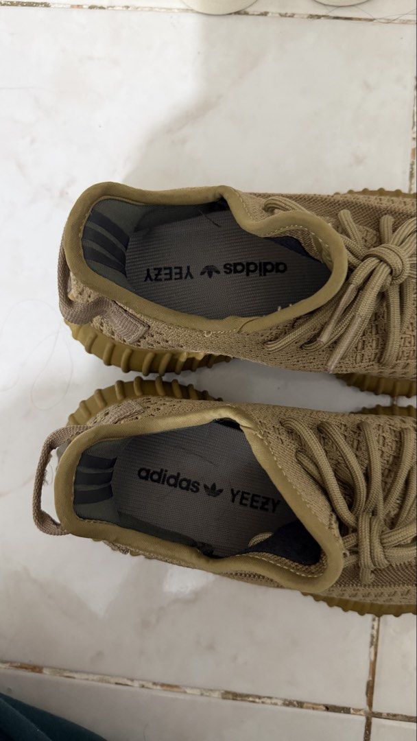 Adidas Yeezy Boost 350 V2 Earth (Category: Sneakers) located in Bacoor. Submitted by kndllklnx (Listing ID 1470250698, Image 2). Description: Adidas Yeezy Boost 350 V2 Earth US 5.5 - Colorway: Earth Brown - Upper: Breathable Prime-knit with translucent side stripe and rope laces - Sole: Ribbed gum rubber with full-length Boost cushioning - Condition: Uppers are clean; minor dirt and heel pad discoloration from previous wear - Perfect for daily we