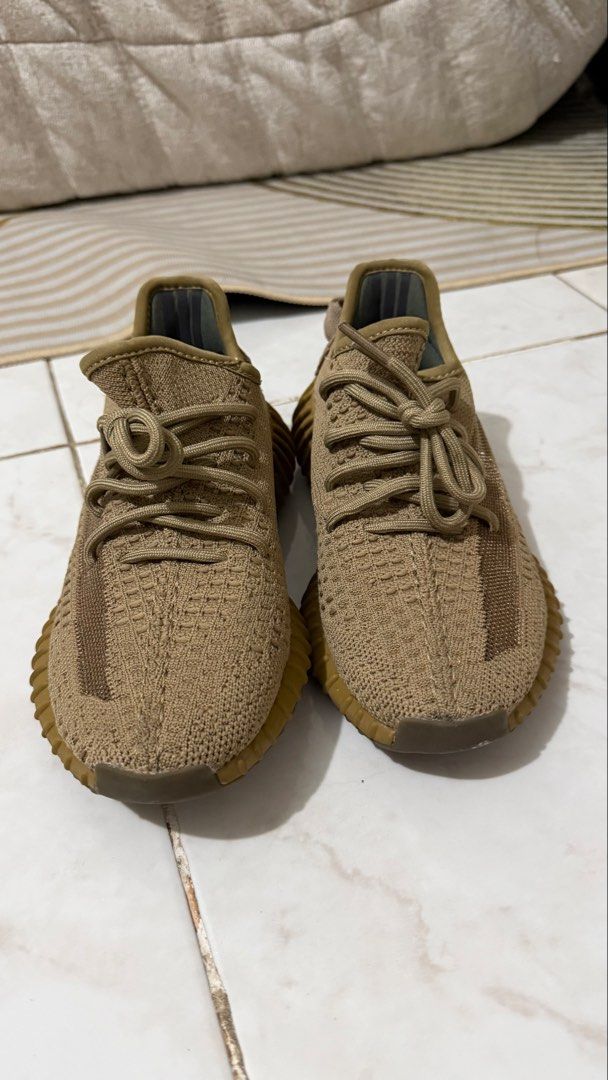 Adidas Yeezy Boost 350 V2 Earth (Category: Sneakers) located in Bacoor. Submitted by kndllklnx (Listing ID 1470250698, Image 1). Description: Adidas Yeezy Boost 350 V2 Earth US 5.5 - Colorway: Earth Brown - Upper: Breathable Prime-knit with translucent side stripe and rope laces - Sole: Ribbed gum rubber with full-length Boost cushioning - Condition: Uppers are clean; minor dirt and heel pad discoloration from previous wear - Perfect for daily we