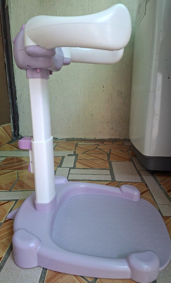 Adjustable Baby Standing Bath (Category: Kids Tables & Chairs) located in Rizal. Submitted by ellaescara12411 (Listing ID 1470202262, Image 2). Description: Pre-loved and still in good condition. ✨ Cute purple and white design ✨ Adjustable height ✨ Wide base for standing support ✨ Ideal for babies and toddlers, depending on their age and developmental stage 📏 Height: Approximately 55 cm (based on the ruler shown; please see photos for reference)