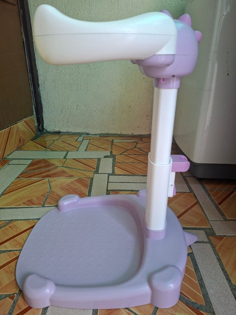 Adjustable Baby Standing Bath (Category: Kids Tables & Chairs) located in Rizal. Submitted by ellaescara12411 (Listing ID 1470202262, Image 3). Description: Pre-loved and still in good condition. ✨ Cute purple and white design ✨ Adjustable height ✨ Wide base for standing support ✨ Ideal for babies and toddlers, depending on their age and developmental stage 📏 Height: Approximately 55 cm (based on the ruler shown; please see photos for reference)