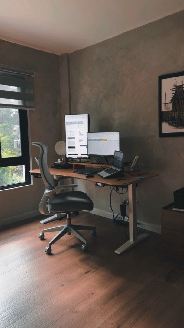 Adjustable Standing Desk/Office Desk with Wooden Top (Category: Office Furniture & Fixtures) located in Antipolo. Submitted by caialexis (Listing ID 1470278607, Image 3). Description: - Type: Motorized standing desk - Design: Light wood-finished top with sturdy white metal legs - Features: Digital height adjustment panel & built-in cable management tray - Condition: Excellent, clean modern setup - Best for: Home office or gaming station - Deliver