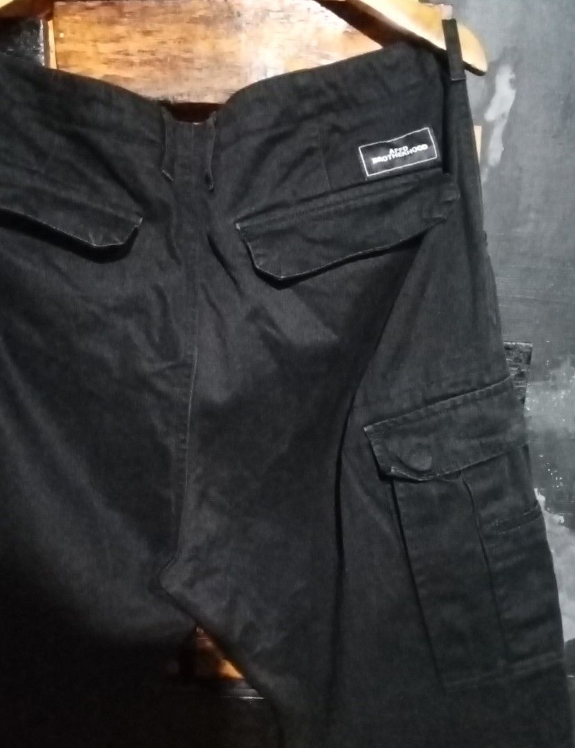 AFFD Brotherhood Black Cargo Pants Size 36 (Category: Jeans) located in Caloocan City. Submitted by calmcat_6fd4f7 (Listing ID 1470345472, Image 3). Description: - Brand: AFFD Brotherhood - Style: Black cargo pants in solid dark wash denim - Storage: Multiple utility pockets on the sides and back - Details: Branded patch sewn above the right back pocket - Waist: 36 inches - Length: 41 inches - Hem: 7 inches.