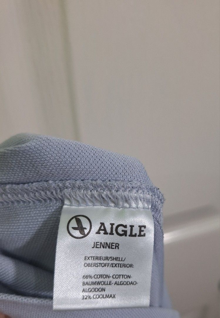 Aigle mbroidered sweatshirt medium - large (Category: Longsleeves) located in San Pablo. Submitted by allyourbrandedneeds (Listing ID 1470145055, Image 3). Description: - Brand/Model: Aigle Jenner - Size: 40 - Color: Light blue - Material: 68% cotton, 32% coolmax fabric - Details: Embroidered anchor graphic on chest, text print on sleeve, button placket at the neck - Condition: Clean overall, great pre-loved condition.