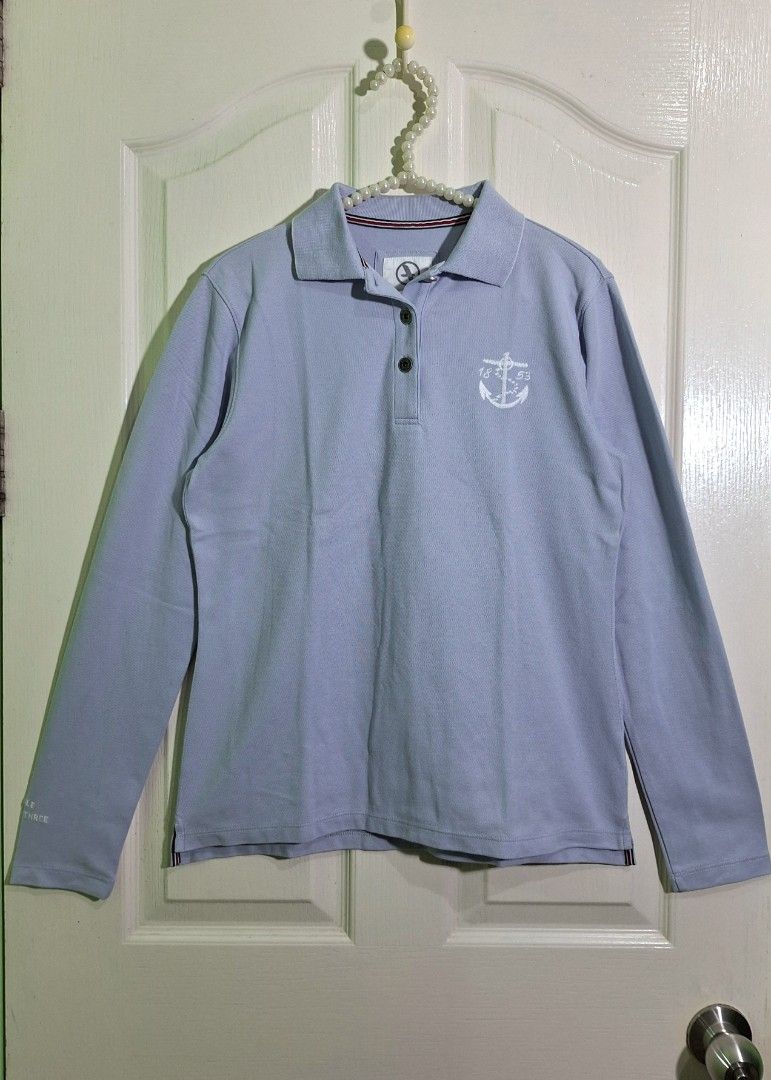 Aigle mbroidered sweatshirt medium - large (Category: Longsleeves) located in San Pablo. Submitted by allyourbrandedneeds (Listing ID 1470145055, Image 2). Description: - Brand/Model: Aigle Jenner - Size: 40 - Color: Light blue - Material: 68% cotton, 32% coolmax fabric - Details: Embroidered anchor graphic on chest, text print on sleeve, button placket at the neck - Condition: Clean overall, great pre-loved condition.
