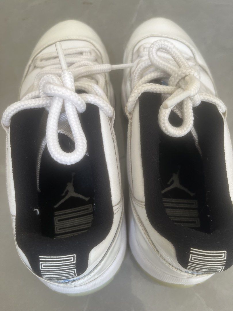 Air Jordan 11 Retro Low Legend (Category: Sneakers) located in Bulacan. Submitted by jhemieee (Listing ID 1470191858, Image 3). Description: - Model: Air Jordan 11 Retro Low - Colorway: White leather upper, black inner lining, light blue Jumpman logo, and icy translucent outsoles - Size: US 8 / UK 7 / EUR 41 / CM 26 - Origin: Made in China - Production Period: 09/30/20 to 01/22/21 - Condition: Regular wear visible on leather panels and midsoles.