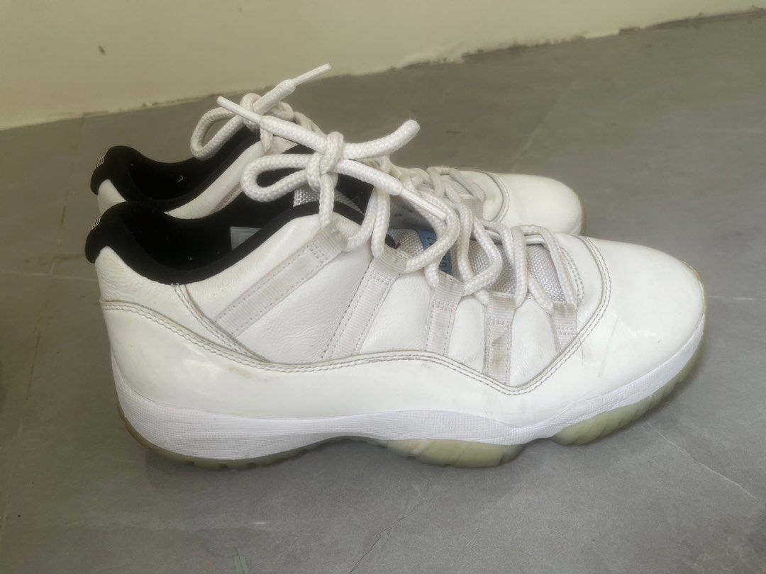 Air Jordan 11 Retro Low Legend (Category: Sneakers) located in Bulacan. Submitted by jhemieee (Listing ID 1470191858, Image 1). Description: - Model: Air Jordan 11 Retro Low - Colorway: White leather upper, black inner lining, light blue Jumpman logo, and icy translucent outsoles - Size: US 8 / UK 7 / EUR 41 / CM 26 - Origin: Made in China - Production Period: 09/30/20 to 01/22/21 - Condition: Regular wear visible on leather panels and midsoles.