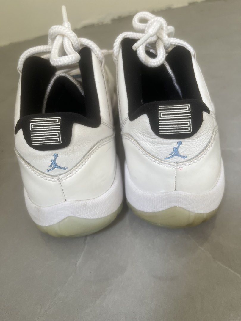 Air Jordan 11 Retro Low Legend (Category: Sneakers) located in Bulacan. Submitted by jhemieee (Listing ID 1470191858, Image 2). Description: - Model: Air Jordan 11 Retro Low - Colorway: White leather upper, black inner lining, light blue Jumpman logo, and icy translucent outsoles - Size: US 8 / UK 7 / EUR 41 / CM 26 - Origin: Made in China - Production Period: 09/30/20 to 01/22/21 - Condition: Regular wear visible on leather panels and midsoles.