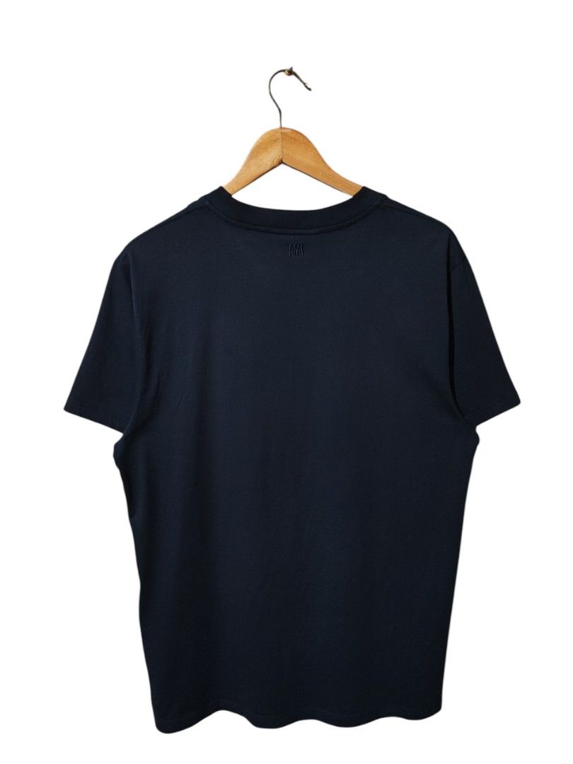 ALEXANDER MATTIUSSI 'AMI' SMALL HEART LOGO TEE (Category: Shirts) located in Iloilo. Submitted by gooddimes (Listing ID 1470216088, Image 2). Description: Alexander Mattiussi 'AMI' Small Heart Logo Tee Authentic Fresh from bale Embroidered Chest Logo Dark Blue color Size on tag: Large Dimes: 20.5x28L Issue/s: Sign of Usage Color rate: 9/10, Neckline 8.8/10 Good condition ₱1,499 +sf Reminders: - All items are thrifted, please manage your expectati