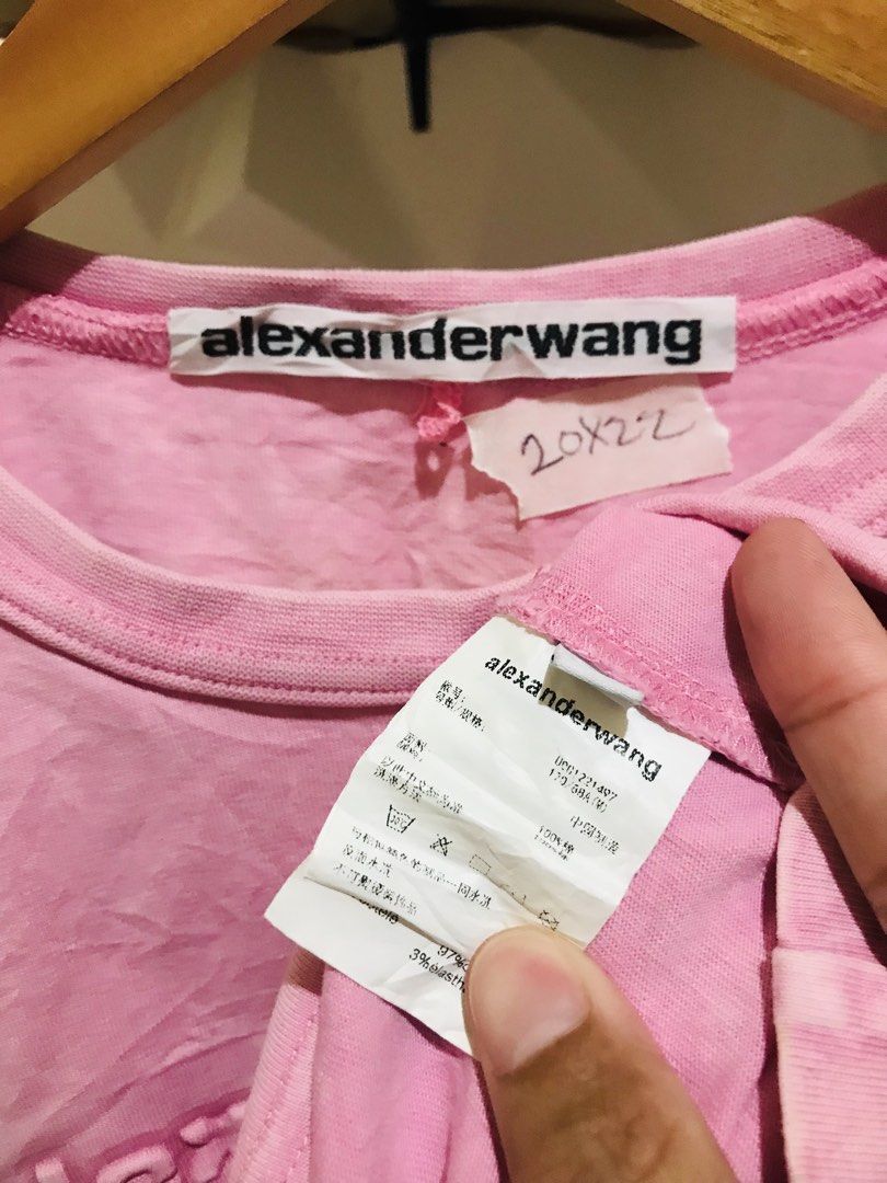 Alexander Wang Pink Debossed Logo T-shirt (Category: Luxury Apparel) located in Manila. Submitted by luxurybrandedthrift05 (Listing ID 1470213193, Image 2). Description: - Brand: Alexander Wang - Item: Debossed Logo T-Shirt - Color: Pink with contrasting tone logo - Size: M - Material: Soft cotton blend with a great handfeel - Design: Raised debossed "alexanderwang new york" lettering on chest, short sleeves, crew neckline - Details: Includes ori