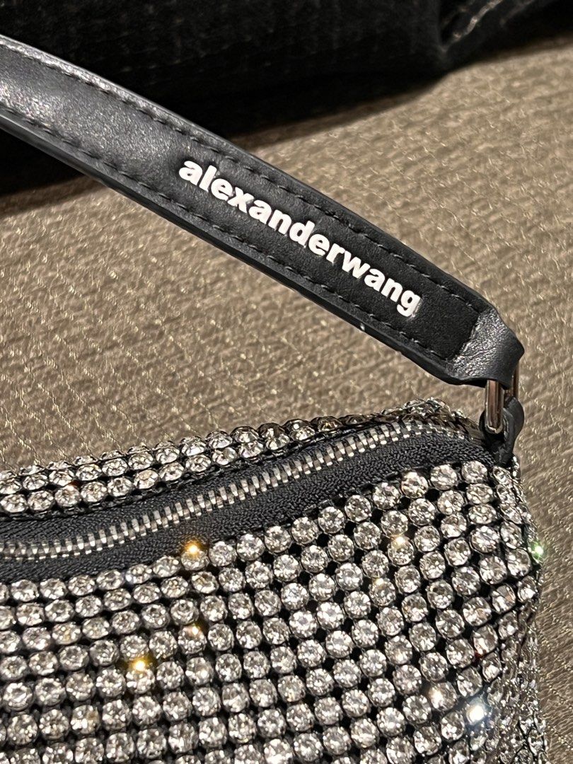 Alexander Wang Rhinestone Small Handbag Black (Category: Luxury Bags & Wallets) located in Manila. Submitted by gentlefox.d9cb54 (Listing ID 1470247785, Image 1). Description: - Brand: Alexander Wang - Color: Black with all-over sparkling crystals - Details: Single leather shoulder strap with printed white brand name, silver-tone top zipper closure - Capacity: Compact size, fits phone, cards, and keys easily - Condition: Pristine interior and ext