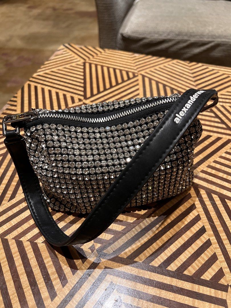 Alexander Wang Rhinestone Small Handbag Black (Category: Luxury Bags & Wallets) located in Manila. Submitted by gentlefox.d9cb54 (Listing ID 1470247785, Image 3). Description: - Brand: Alexander Wang - Color: Black with all-over sparkling crystals - Details: Single leather shoulder strap with printed white brand name, silver-tone top zipper closure - Capacity: Compact size, fits phone, cards, and keys easily - Condition: Pristine interior and ext