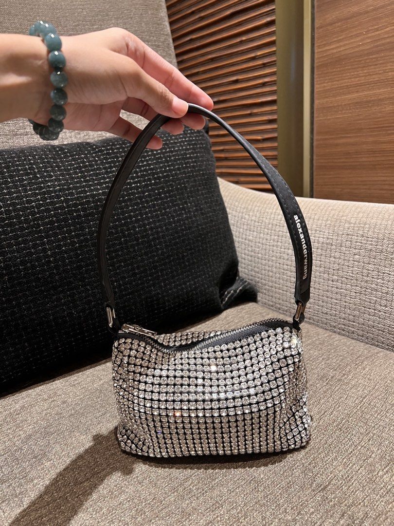 Alexander Wang Rhinestone Small Handbag Black (Category: Luxury Bags & Wallets) located in Manila. Submitted by gentlefox.d9cb54 (Listing ID 1470247785, Image 2). Description: - Brand: Alexander Wang - Color: Black with all-over sparkling crystals - Details: Single leather shoulder strap with printed white brand name, silver-tone top zipper closure - Capacity: Compact size, fits phone, cards, and keys easily - Condition: Pristine interior and ext