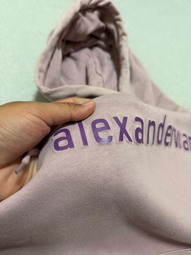 Alexanderwang Embossed Logo Hoodie Jacket (Category: Hoodies) located in Bulacan. Submitted by sanjisthrift (Listing ID 1470303640, Image 3). Description: Size Medium Width 21.5 Length 25.5 Good Condition 9/10 Slightly fade.