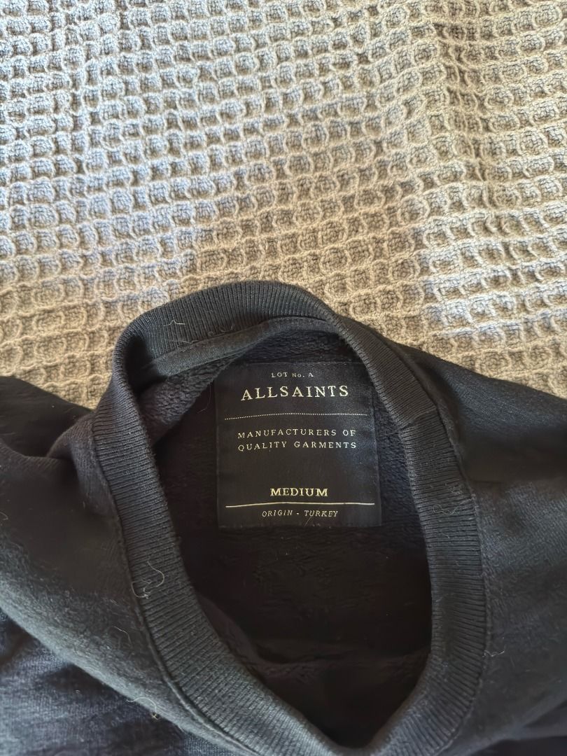 AllSaints Sirius Crew Sweatshirt Black Medium (Category: Coats, Jackets and Outerwear) located in Cebu City. Submitted by _t.rix (Listing ID 1470191103, Image 2). Description: - Brand: AllSaints - Model: Sirius Crew Sweatshirt - Color: Black - Size: Medium - Material: Cotton body with goat suede panel details on sleeves - Origin: Made in Turkey - Care: Dry clean only - Details: Ribbed collar, cuffs, and hem - Condition: Clean piece with solid con