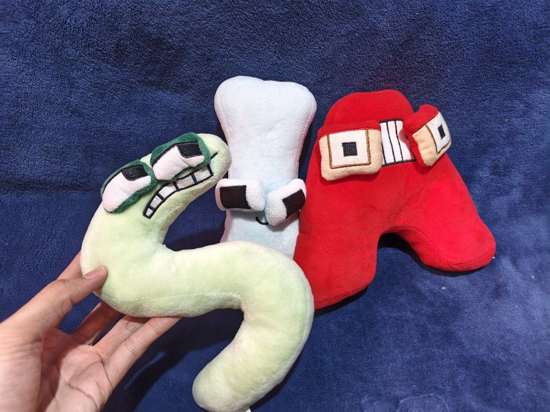 Alphabet Lore Plush Toy Set - S, I, A (Category: Plushies & Soft Toys) located in Manila. Submitted by kirstentoyshub (Listing ID 1470247158, Image 2). Description: - Set includes 3 Alphabet Lore plush toys: Green S, Light Blue I, and Red A - Made of soft fabric with detailed embroidered facial features - Great collectible items for fans of the animated series.