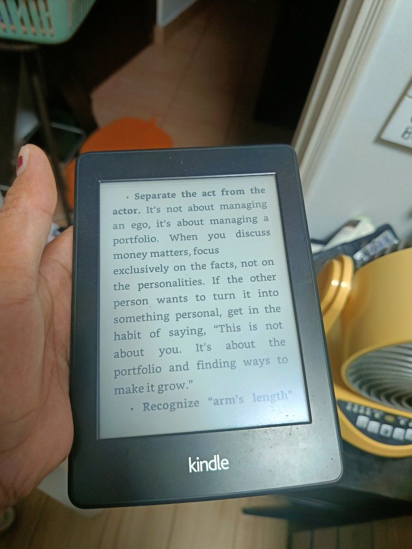 Amazon Kindle E-Reader (Category: E-Readers) located in Singapore. Submitted by livedog_7bdbb1 (Listing ID 1470301970, Image 1). Description: - Model: Amazon e-reader (Black) - Condition: Fully functional screen and battery; visible scratches on the back casing from normal use - Features: Clear display for reading, lightweight design, holds a great charge - Ports: Standard micro-USB charging port next to the power button - Perks: Perfect portable