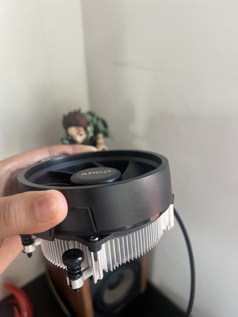 AMD Wraith CPU Cooler Stock Fan (Category: Computer Parts) located in Paombong. Submitted by declutteredbychee_ (Listing ID 1470232786, Image 2). Description: - Stock AMD CPU cooler (unused) - Standard aluminum heatsink with black fan shroud - Clean fins with no bent metal - Fully functional fan with standard 4-pin connector - Compatible with AMD AM4 and related sockets - Pre-installed mounting screws included for easy installation.