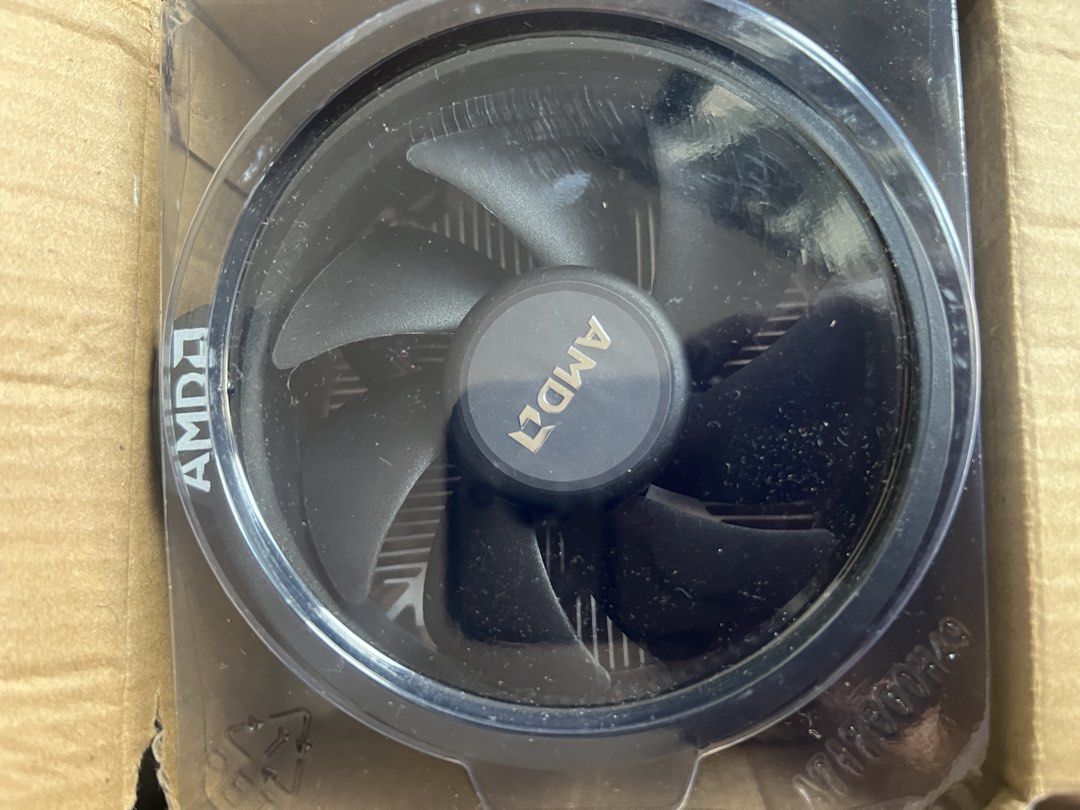 AMD Wraith CPU Cooler Stock Fan (Category: Computer Parts) located in Paombong. Submitted by declutteredbychee_ (Listing ID 1470232786, Image 3). Description: - Stock AMD CPU cooler (unused) - Standard aluminum heatsink with black fan shroud - Clean fins with no bent metal - Fully functional fan with standard 4-pin connector - Compatible with AMD AM4 and related sockets - Pre-installed mounting screws included for easy installation.