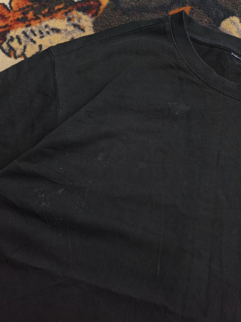 Ami Paris Black T-Shirt with Logo Patch (Category: Tshirts & Polo Shirts ) located in Davao. Submitted by simonandre53791 (Listing ID 1470253506, Image 3). Description: - Brand: Ami Paris - Color: Black with white/grey embroidered heart logo - Material: 100% Cotton, regular fit with classic crew neck - Condition: Pre-loved with visible faded areas and minor light marks near the lower front and chest - Authenticity: 100% genuine, PM for inquiries 