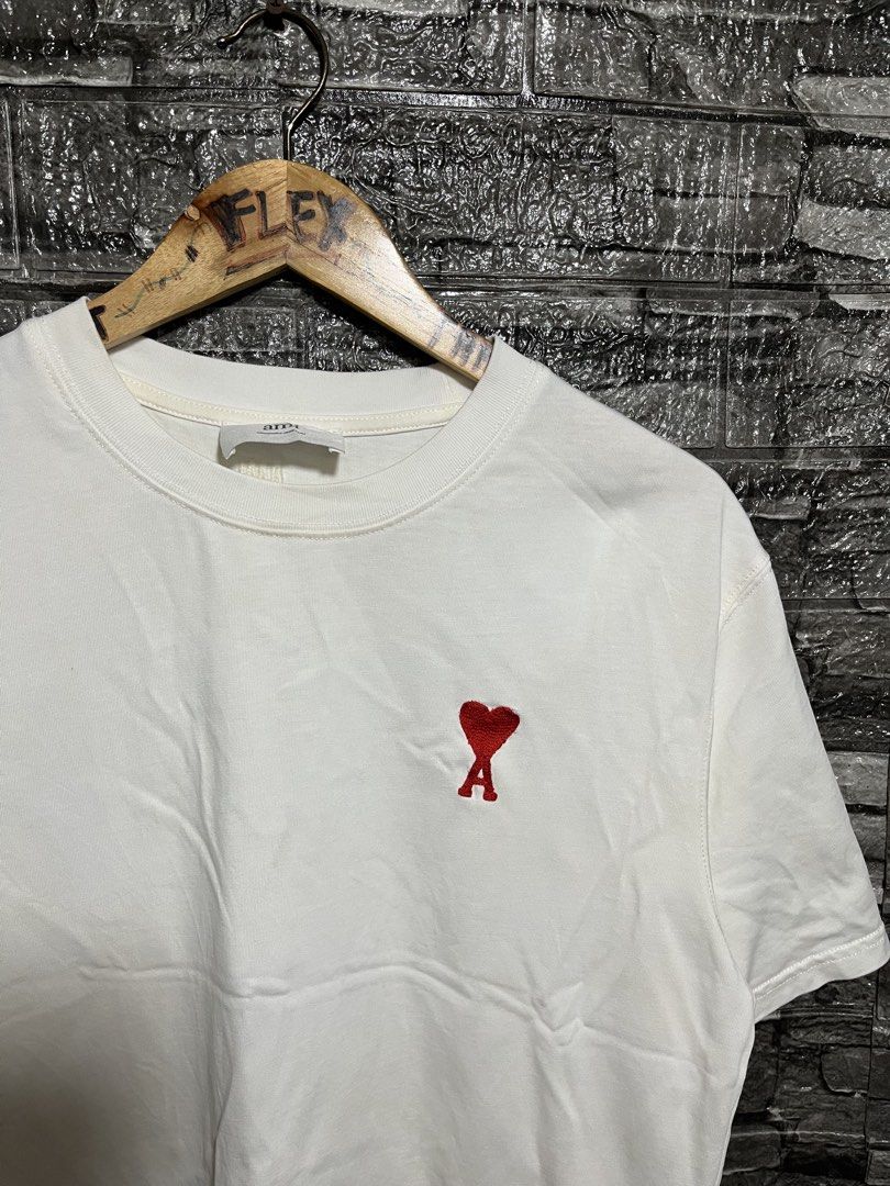 Ami Paris De Cour Embroidered Logo Shirt (Category: Luxury Apparel) located in Manila. Submitted by flex_curation (Listing ID 1470221640, Image 2). Description: 21x25 IN VERY GOOD CONDITION BACOOR CAVITE LOC.
