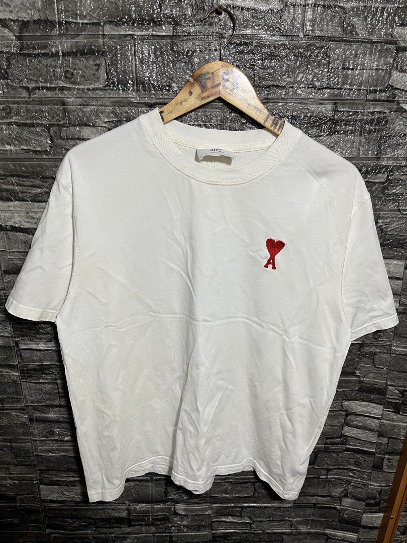 Ami Paris De Cour Embroidered Logo Shirt (Category: Luxury Apparel) located in Manila. Submitted by flex_curation (Listing ID 1470221640, Image 1). Description: 21x25 IN VERY GOOD CONDITION BACOOR CAVITE LOC.